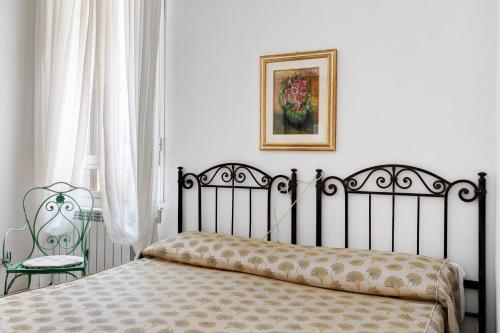 Ένα ή περισσότερα κρεβάτια σε δωμάτιο στο Affittacamere Borgo Trento