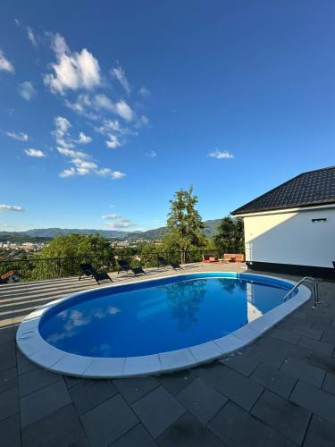 a swimming pool on top of a roof at Amal Residence in Sarajevo