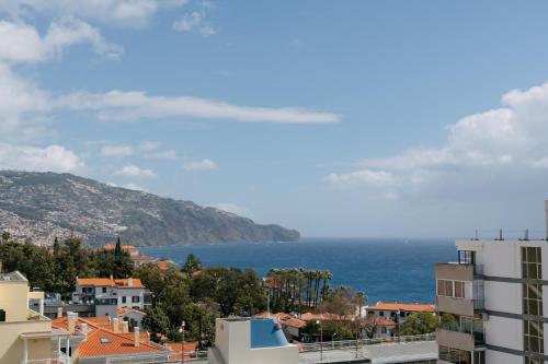 a view of the ocean from a city at Casa Branca Apartments by Wanderlust Madeira, vacation rentals in Funchal
