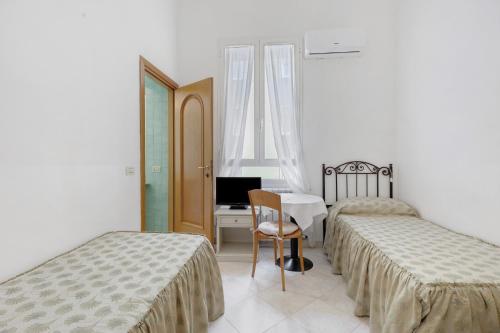 Ένα ή περισσότερα κρεβάτια σε δωμάτιο στο Affittacamere Borgo Trento