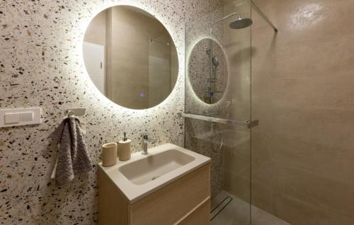 a bathroom with a sink and a mirror at Villa D Cube by Villas Guide in Kremena