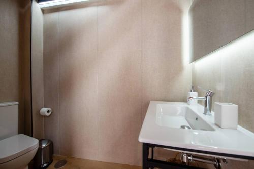 a bathroom with a sink and a toilet at Miravilla 25 Potes 4 in Potes