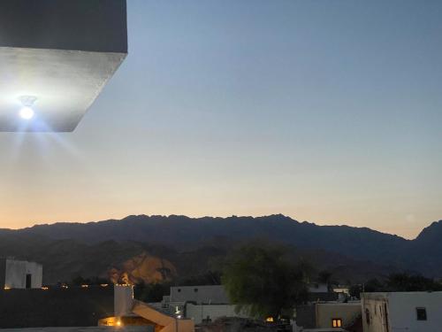 a view of a city with mountains in the background at Dahabiya 2BR Sea View Residence Assala in Dahab