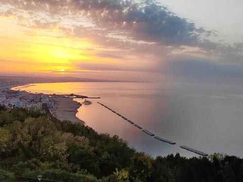 a group of boats in the water at sunset at Bluemar Dolcemare - 105mq in Cattolica