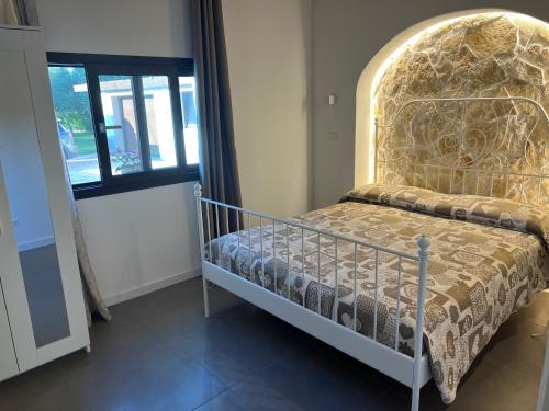 Ένα ή περισσότερα κρεβάτια σε δωμάτιο στο Villa Lutilo'