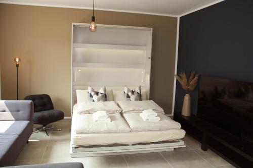 Ένα ή περισσότερα κρεβάτια σε δωμάτιο στο Stilvoll wohnen - Job & Urlaub