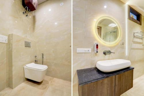 a bathroom with a toilet and a sink and a mirror at Collection O THE PARK LANE in Delhi