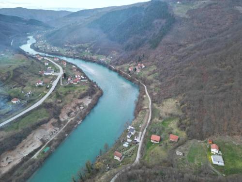 an aerial view of a riverurrency with a highway at Prenoćište na Drini-Vikendica 2 in Foča