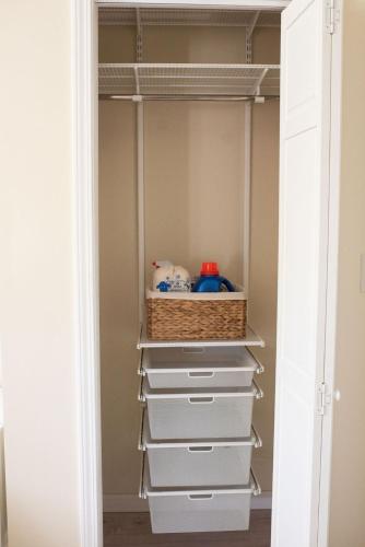 a walk in closet with drawers and a basket at The Nautilus at JS Hubbs Guest House in Hammondsport