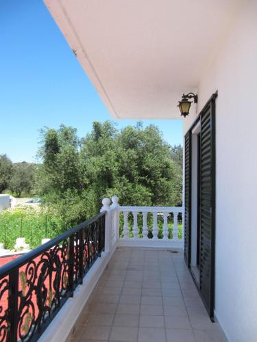 a balcony with a black and white railing at Castellino Zwillingsstudios in Kallithea Rhodes