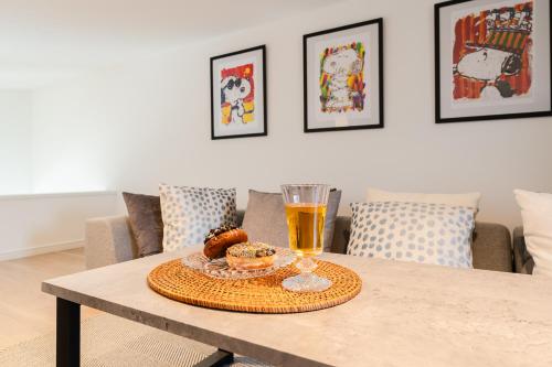 a table with a tray of food and a glass of beer at Sangenjaya Modern Stay in Tokyo
