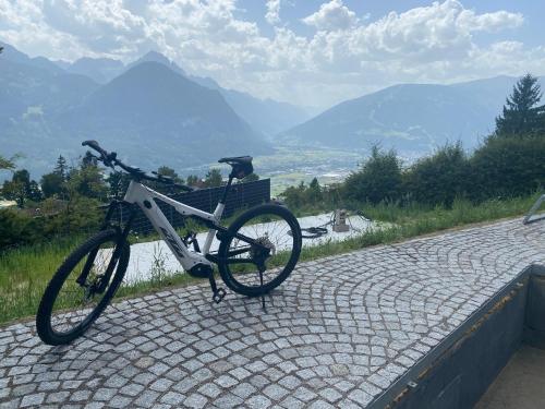 a bike parked on the side of a road at s`gmiatli in Iselsberg