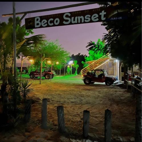 a jeep parked in a parking lot at night at Pousada Zona do Kite Jeri in Jericoacoara