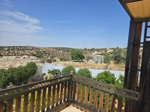 a view from the balcony of a house at Charming Farmhouse for Lease in Ed Deir
