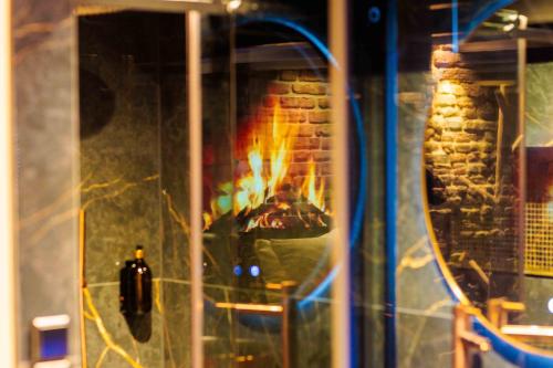 a brick oven with a fire in it at Hotel de Prince in Nijmegen