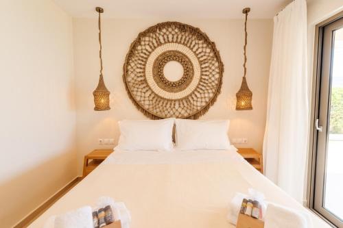 a bedroom with a bed and a mirror on the wall at House Eleni in Agios Georgios Pagon