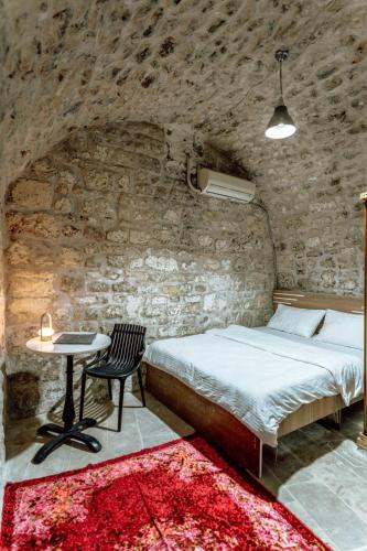 Ένα ή περισσότερα κρεβάτια σε δωμάτιο στο Sermest House