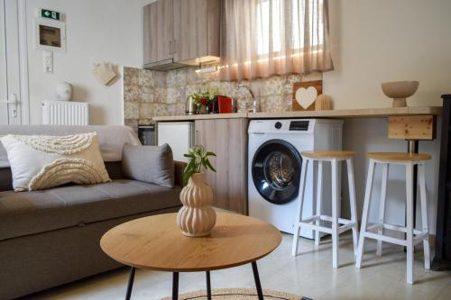 a living room with a couch and a table at Daniela Village House in Keri