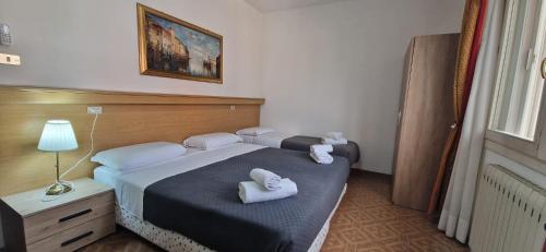 Letto o letti in una camera di Hotel Tito Venice
