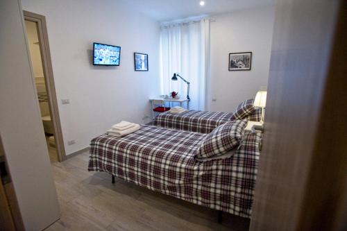 a hotel room with two beds in a room at Fellini in Rome