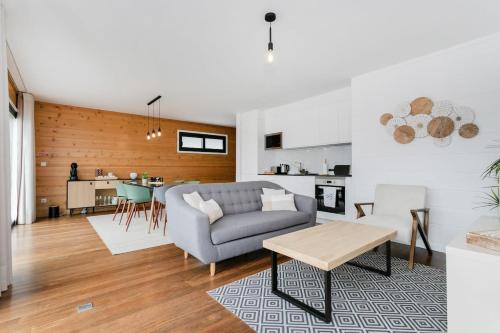 a living room with a couch and a table at GuestReady - Good Vibes in Ponta Delgada