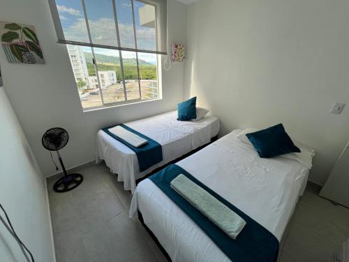 Postel nebo postele na pokoji v ubytování Hermoso apartamento en Girardot con vista a la montaña