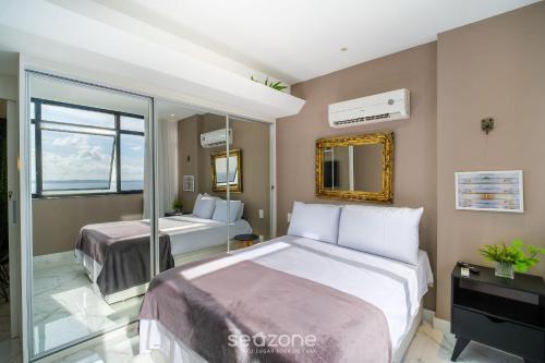 Ένα ή περισσότερα κρεβάτια σε δωμάτιο στο Apto Vista Mar na Vitória-SSA - SVM1409