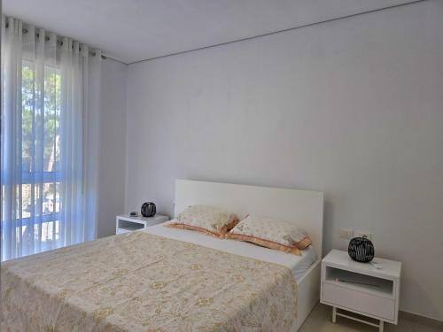 Ένα ή περισσότερα κρεβάτια σε δωμάτιο στο San Pietro Coastal Escape 287