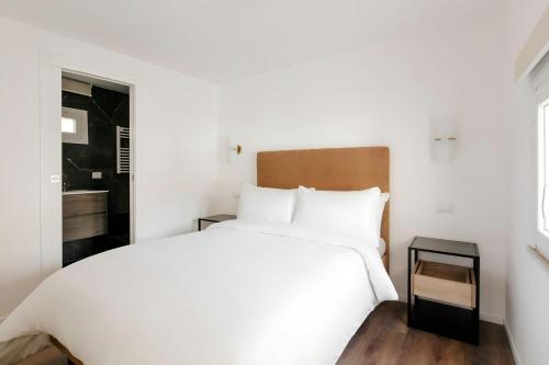 En eller flere senge i et værelse på Sonder by Marriott Bonvoy Piazza Venezia Apartments
