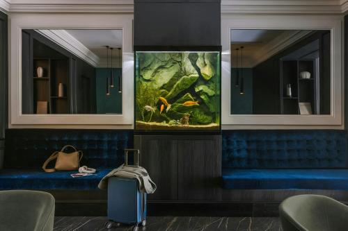 a room with two mirrors and a suitcase at Missori Hotel Piazza Missori, Sonder by Marriott Bonvoy in Milan