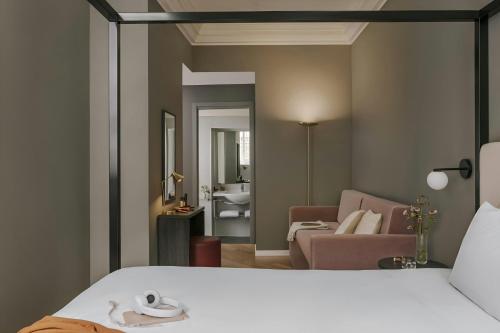 a room with a bed and a living room at Missori Hotel Piazza Missori, Sonder by Marriott Bonvoy in Milan