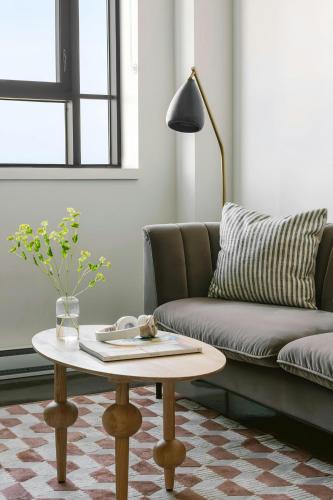a living room with a couch and a coffee table at Sonder by Marriott Bonvoy Le Guerin Apartments Le Plateau-Mont-Royal in Montréal