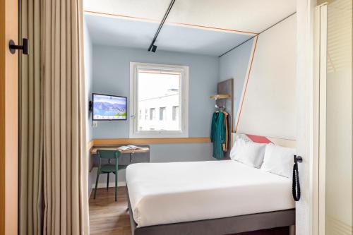 Postel nebo postele na pokoji v ubytování ibis budget Lugano Paradiso