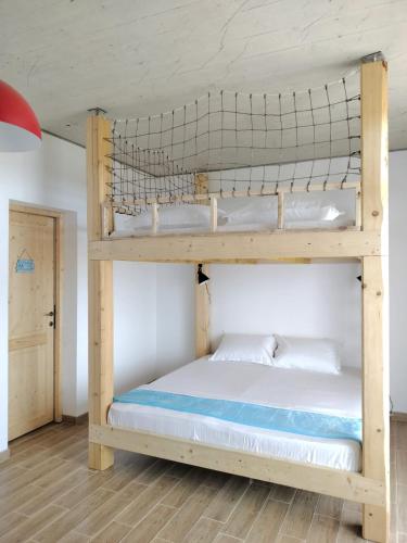 a bedroom with two bunk beds in a room at Wild Serenity in Vadu