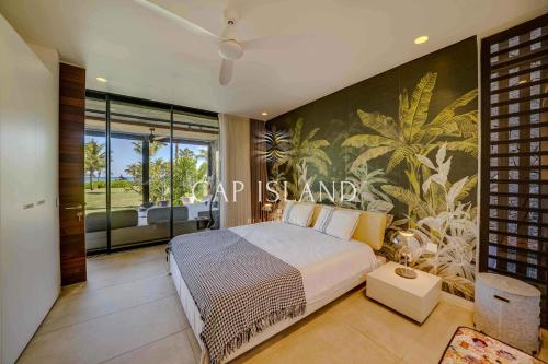 Ένα ή περισσότερα κρεβάτια σε δωμάτιο στο Luxueux appartement sur sa plage privée