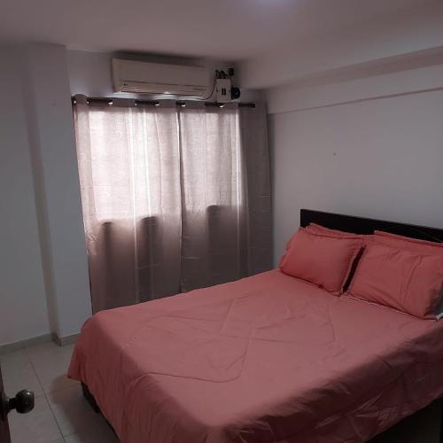 Ένα ή περισσότερα κρεβάτια σε δωμάτιο στο Moderno y familiar Apartamento