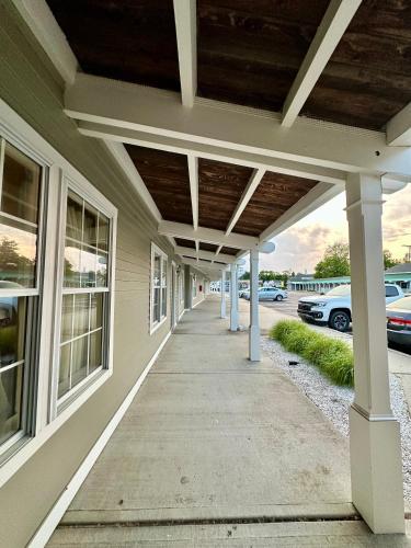 a porch of a house with a covered walkway at Sea Girt Lodge in Sea Girt