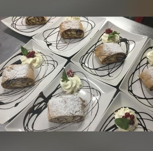 a bunch of desserts on plates on a table at Old Car's Hotel in Selpritsch