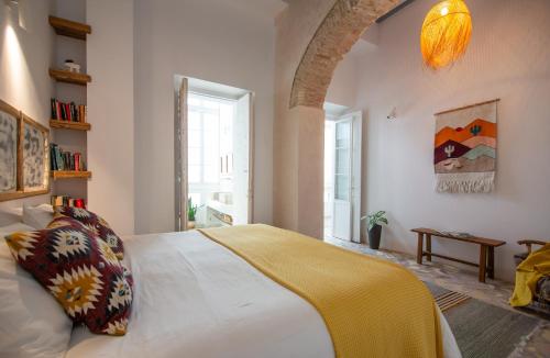 Posteľ alebo postele v izbe v ubytovaní Casa Plaza San Antonio