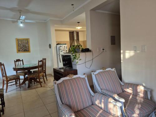 a living room with two couches and a dining room at Departamento Loteo La Plaza in Rivadavia