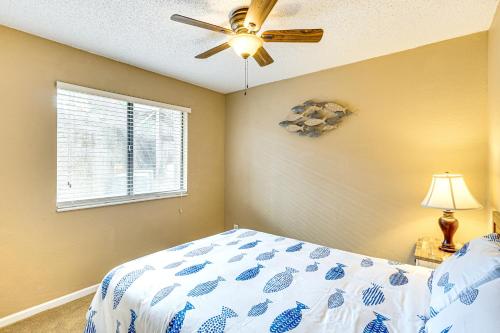 a bedroom with a bed and a ceiling fan at Lakefront Osage Beach Condo Main Channel View! in Osage Beach