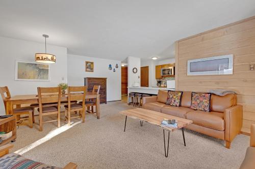 a living room with a couch and a table at Double Eagle A12 by Ski Country Resorts in Breckenridge