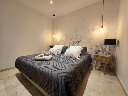 a bedroom with a large bed with pillows on it at Domaine U Filanciu - Centru di Corsica in Moltifao