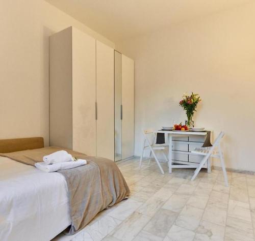 A bed or beds in a room at Farini Cozy Flat