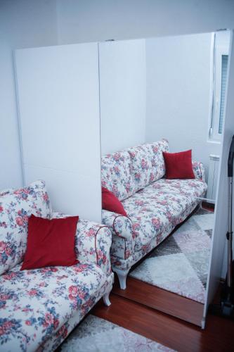a living room with a couch and a mirror at Apartment NAV in Plav