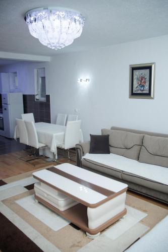 a living room with a couch and a table at Apartment NAV in Plav
