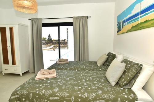 Ένα ή περισσότερα κρεβάτια σε δωμάτιο στο Villa Pitaya - Luxury Escape