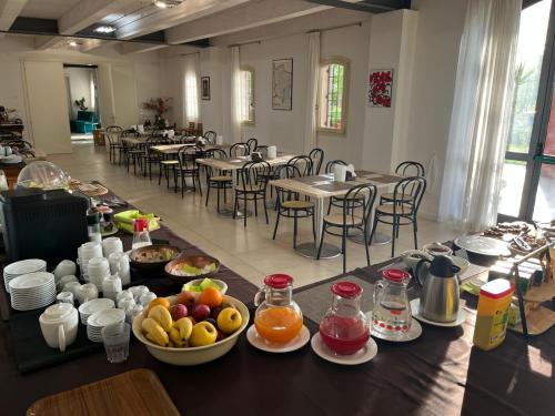 a table with fruit on it in a restaurant at Tenuta Monterosso in Feriole