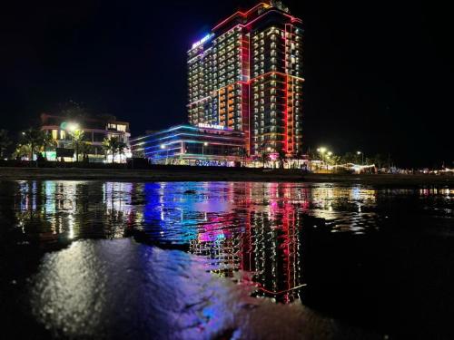 a building with lights on top of it at night at The Lucky House in Thanh Hóa