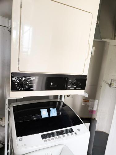 a kitchen with a stove and a microwave at Treetop-forest Flatsunit22 -four Seasons in Four Seasons